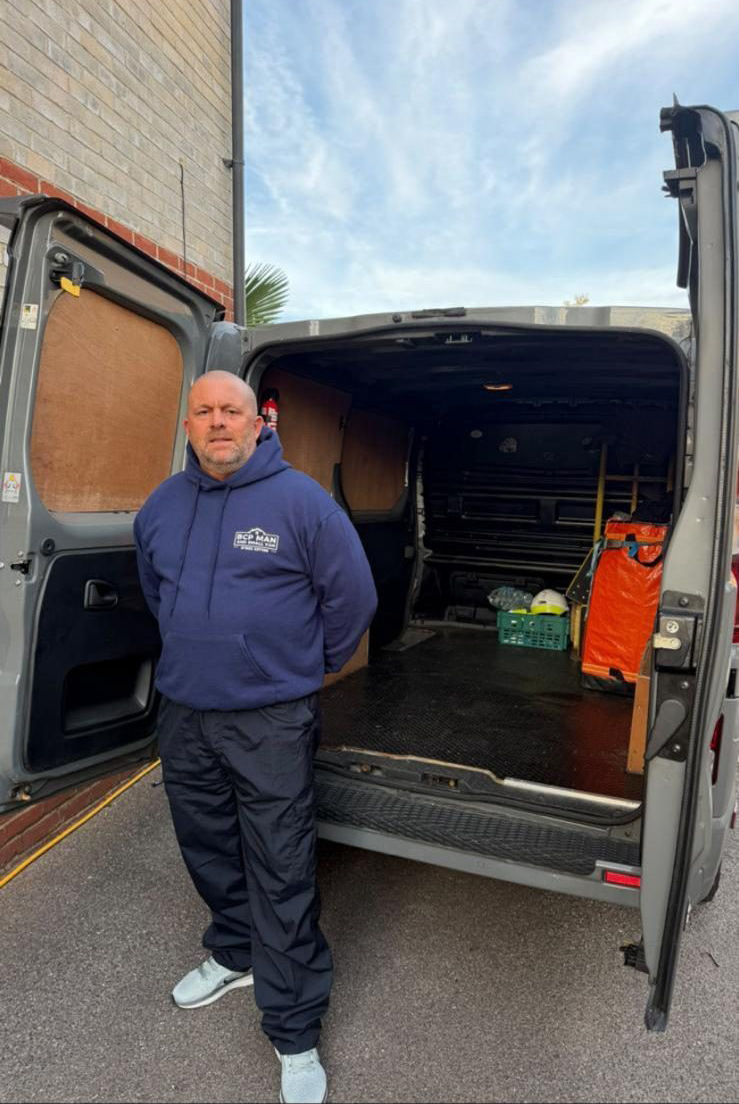 Owner next to van